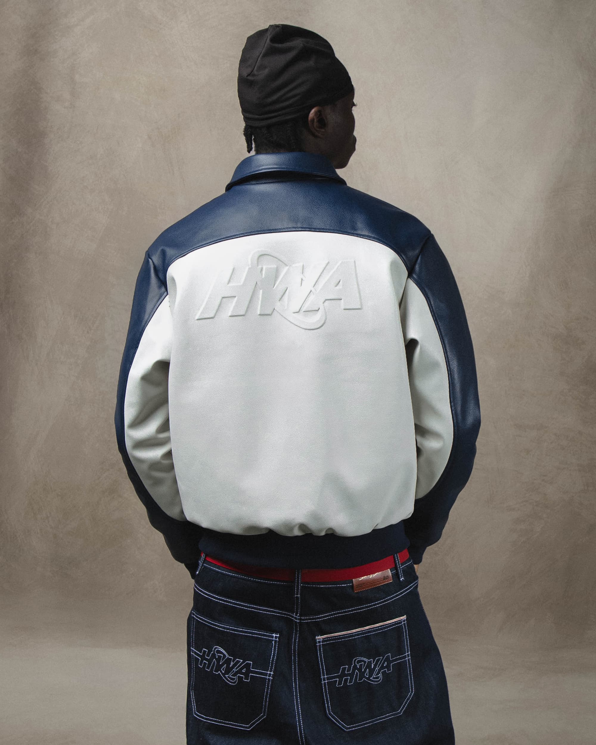 Three 60 blue leather jacket, back lifestyle view